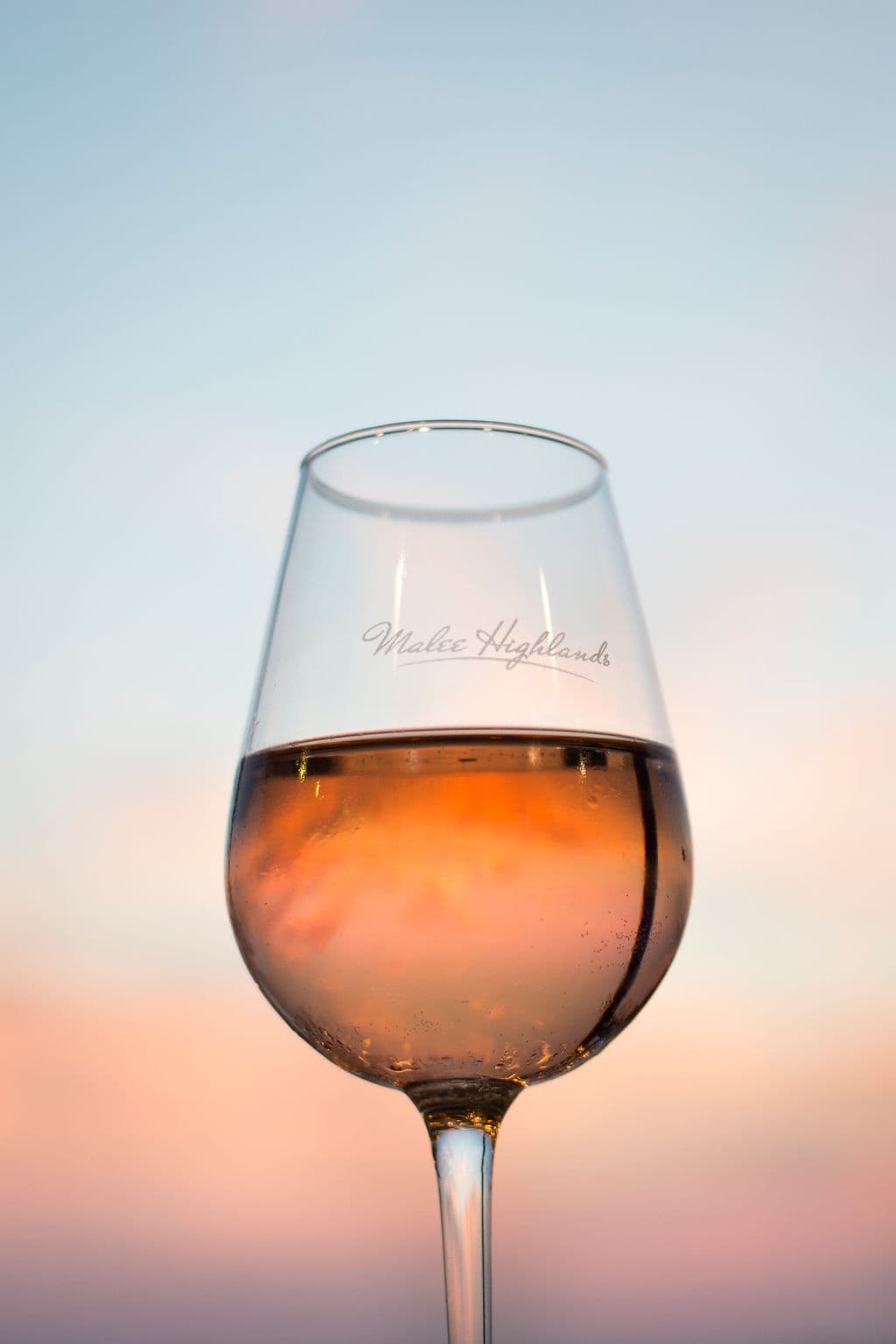 Couple enjoying sunset drinks at Malee Highlands